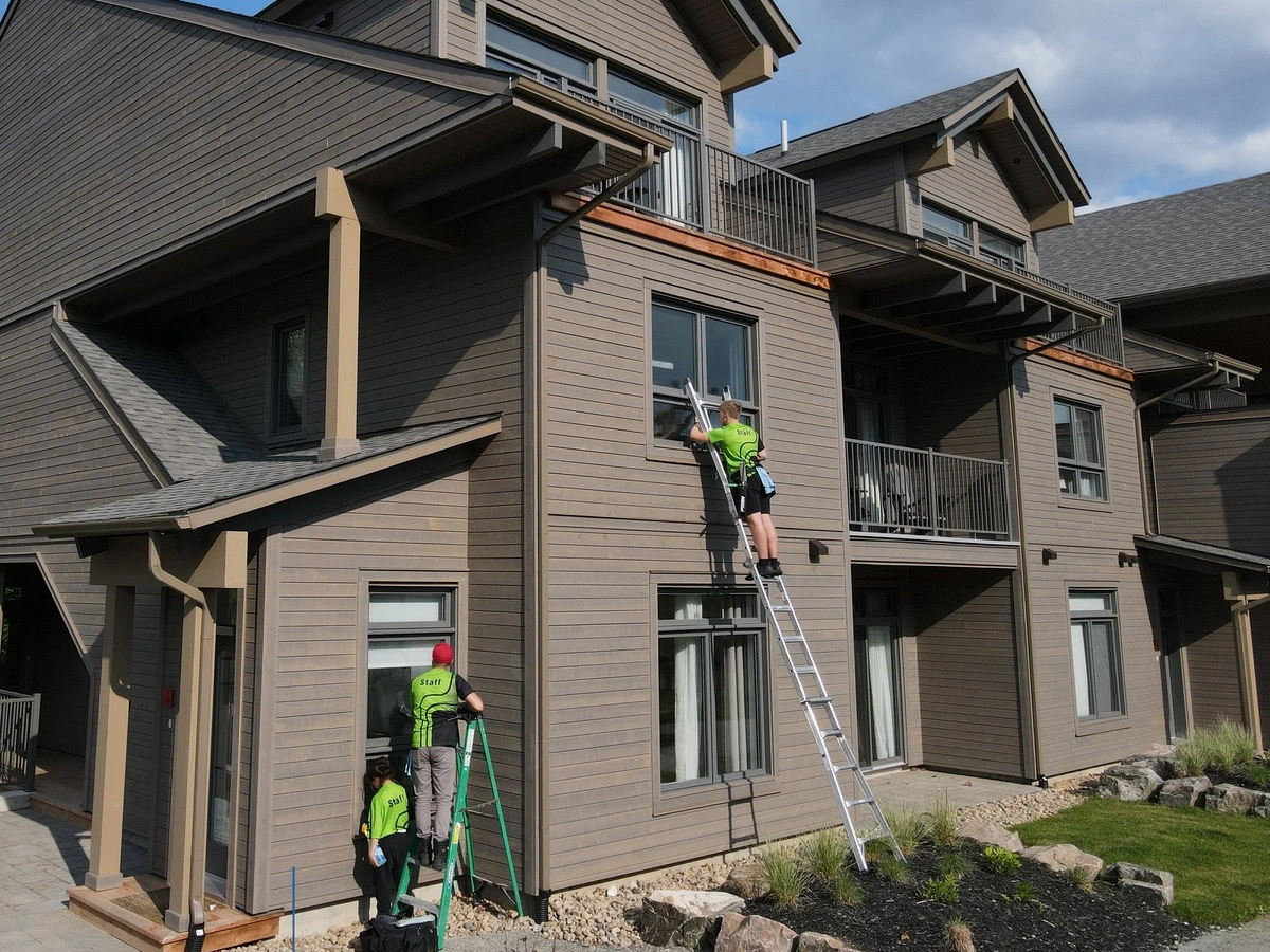 Exterior cleaning services including window cleaning, pressure washing, and gutter cleaning